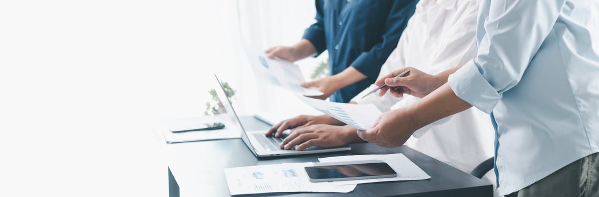 Professionals collaborating on strategy in a modern office